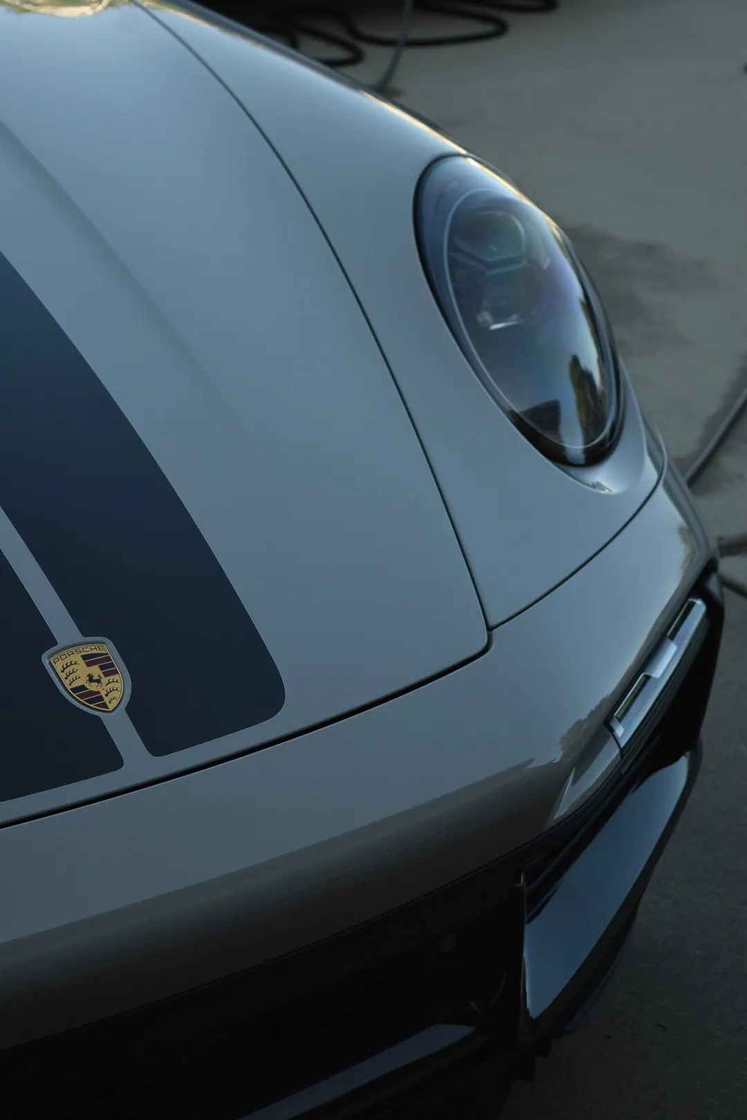 Porsche 911 headlight and hood with a glossy ceramic finish