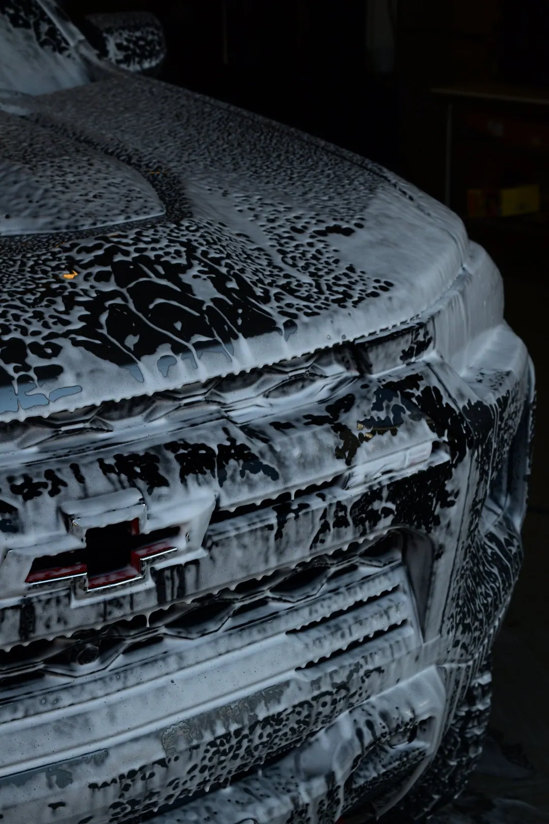 Truck covered in foam during a two-bucket hand wash